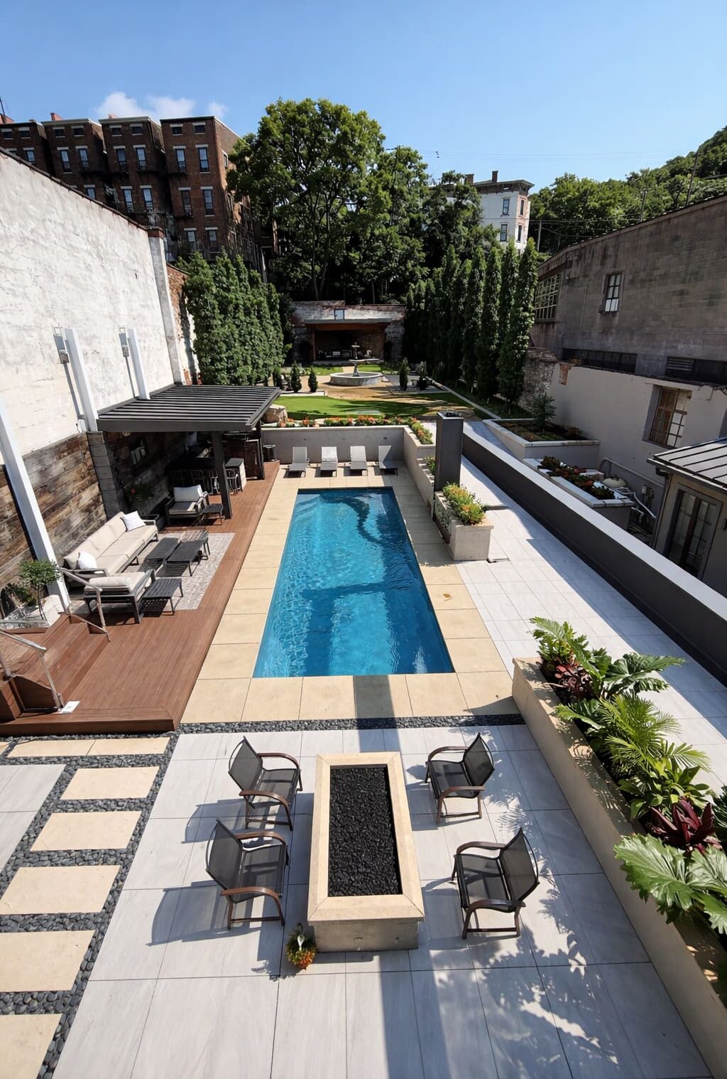 Compact party plunge pool in a landscaped courtyard with pergola and fire pit