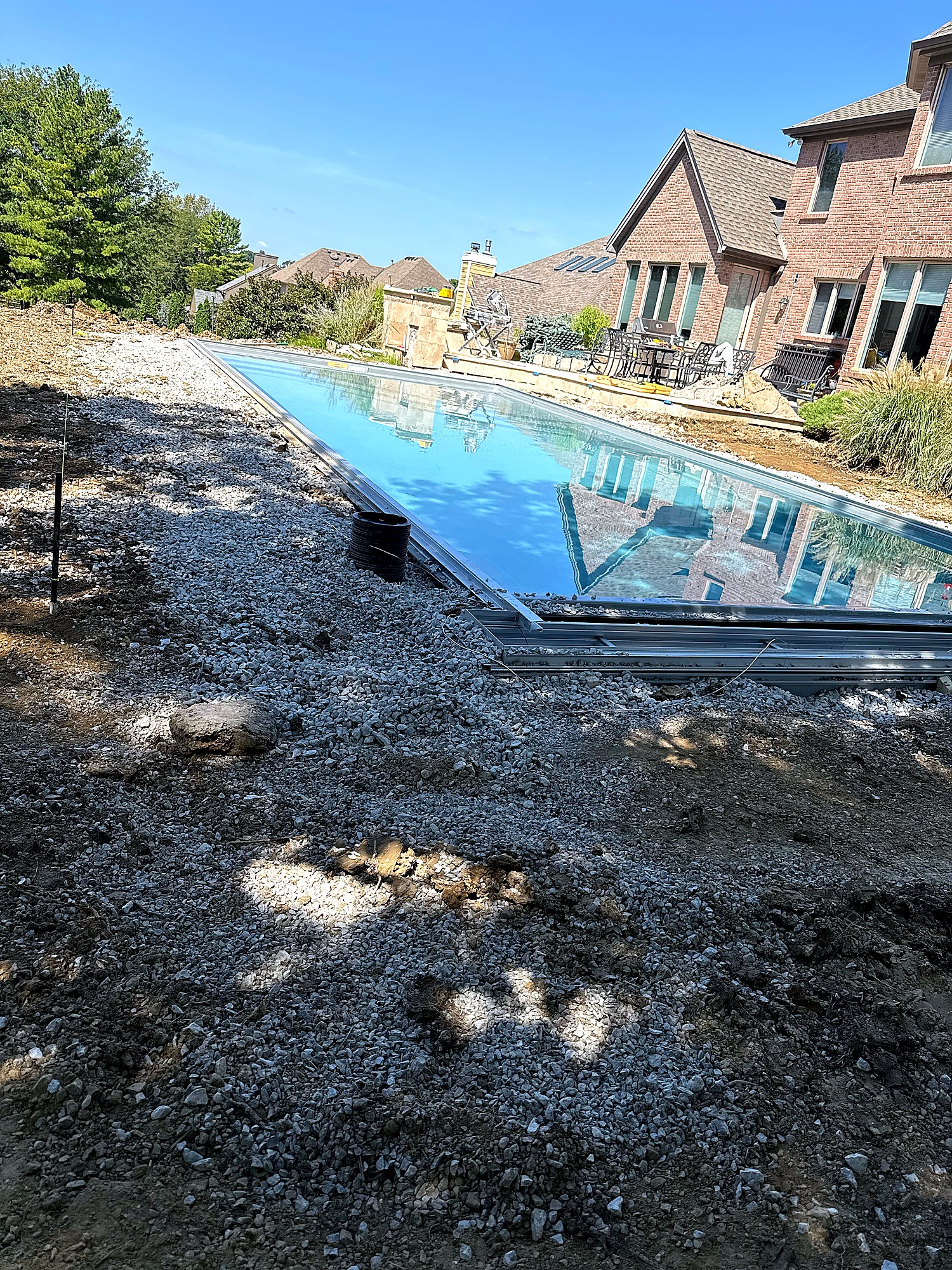 Fiberglass shell set in excavated hole