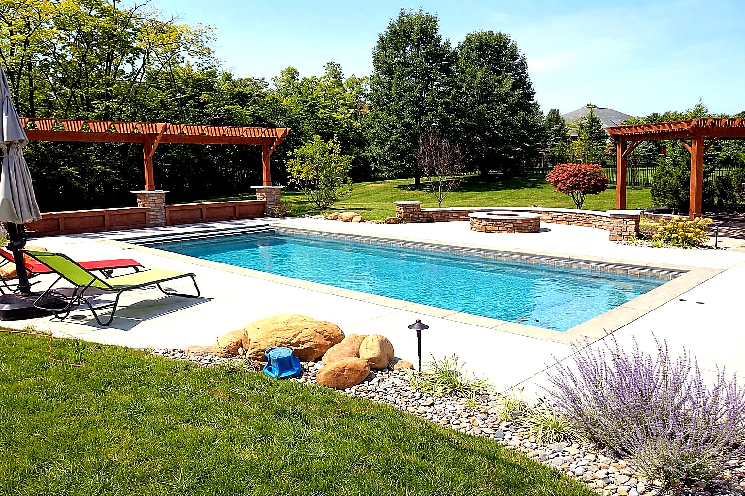 Pool with pergola and fire pit